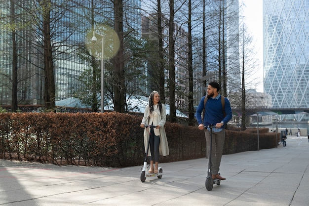 A street scene in a US city with designated lanes for electric scooters and bicycles, showcasing the integration of micro-mobility into the urban infrastructure.