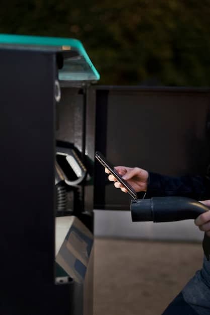 A close-up shot of a technician installing a charging station for electric vehicles, with a focus on the high-tech components and digital interface.