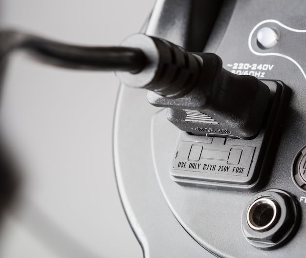 A close-up shot of a DC fast charging connector being plugged into an electric vehicle. The charging station has clear labels indicating the power output and connector type. The background is slightly blurred to focus on the charging process.
