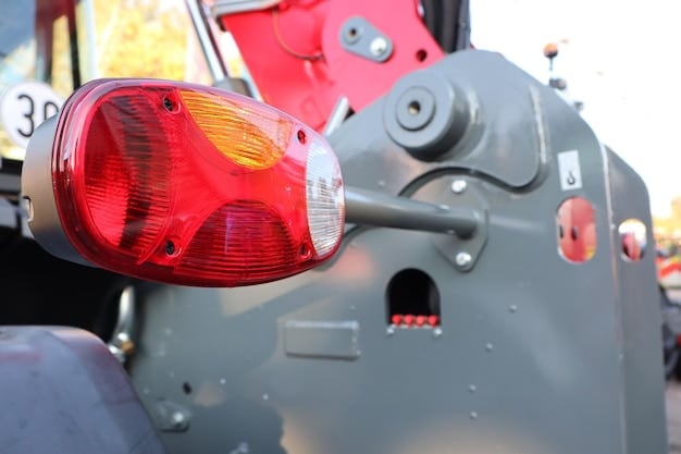 A close-up of an electric truck's hitch and towing equipment, highlighting the robust construction and safety features.
