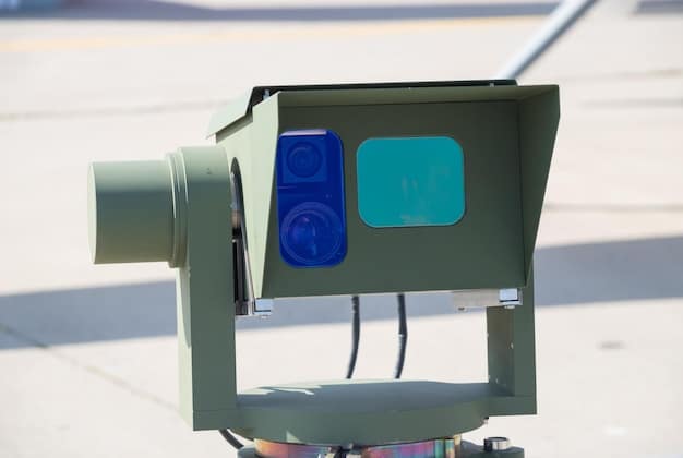 A close-up shot of a vehicle's sensor suite (LiDAR, cameras, radar) that is mounted on top of the vehicle so that it is visible, possibly with city buildings blurred in the background to suggest movement. Emphasizes the technical aspect of autonomous vehicles.