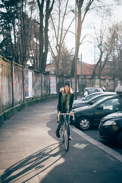 An image of a well-designed, dedicated bike lane in a city, clearly separated from car traffic and pedestrian areas. The lane is filled with people riding e-scooters and e-bikes, highlighting the safety and efficiency of dedicated infrastructure.