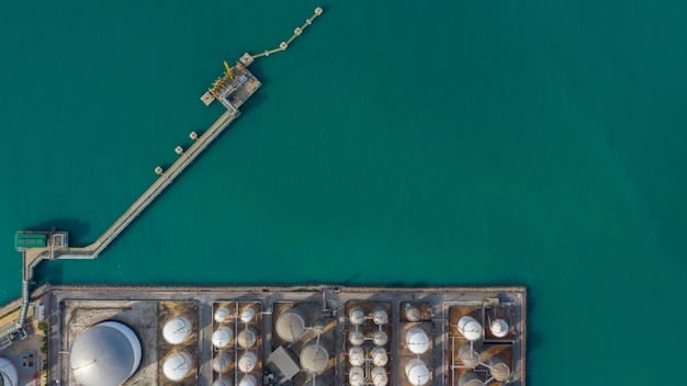 A close-up aerial view of a biofuel production plant, focusing on the processing and refining stages. The image showcases modern technology and equipment, with pipelines, storage tanks, and distillation towers. The plant is set against the backdrop of a rural agricultural landscape, demonstrating the link between farming and biofuel production. Bright sunlight highlights the metallic structures and the surrounding green fields.