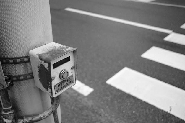 A close-up shot of a smart traffic sensor embedded in the road surface, highlighting its ability to collect real-time data on vehicle speed, traffic volume, and road conditions. The image illustrates the technological foundation of AI-powered traffic management systems.
