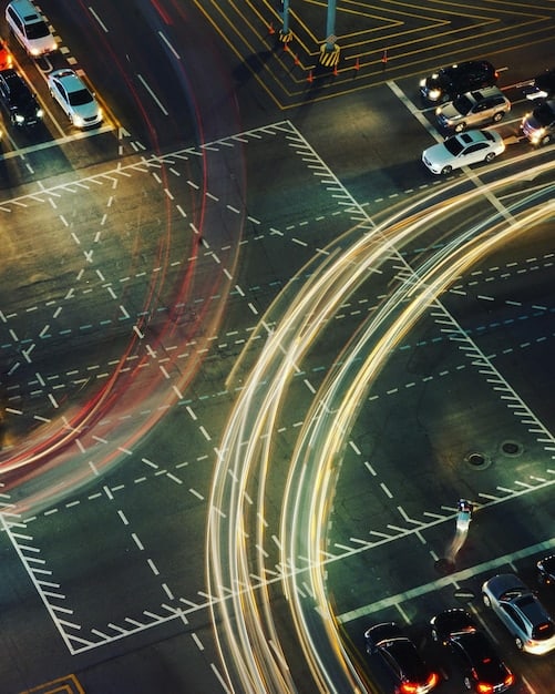 A close-up shot of sensors embedded in a highway, with a vehicle driving over them, and a digital overlay illustrating the data being collected and transmitted in real-time.